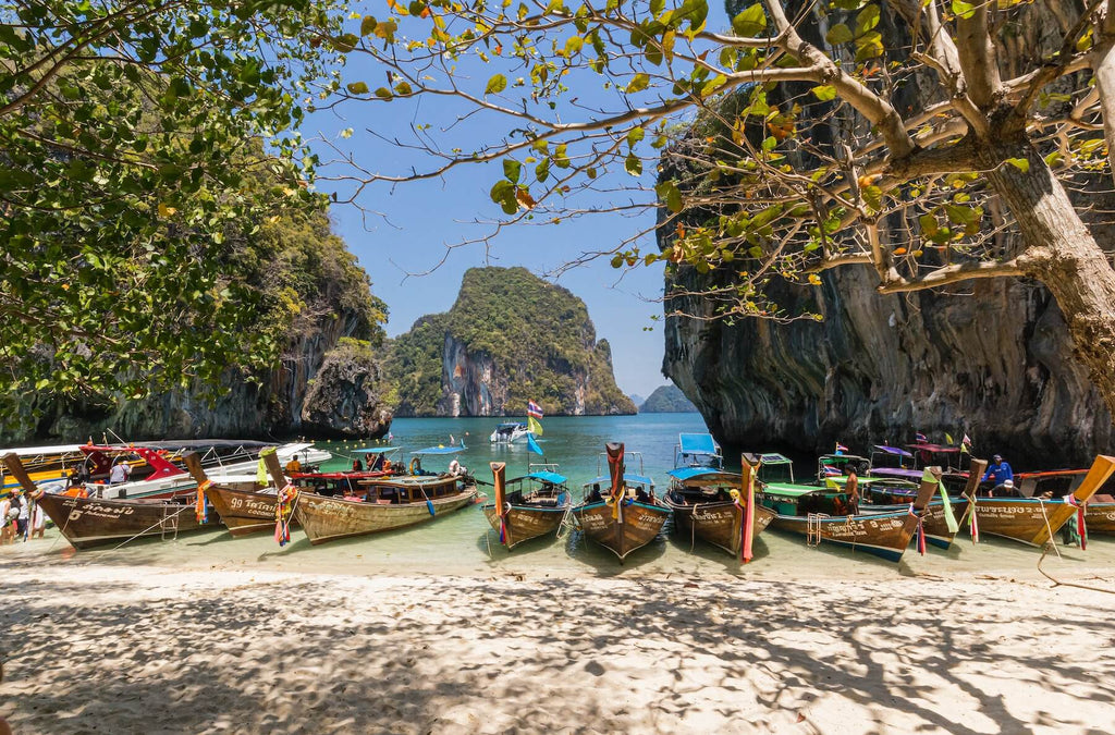 Longboats on a beach in Thailand 