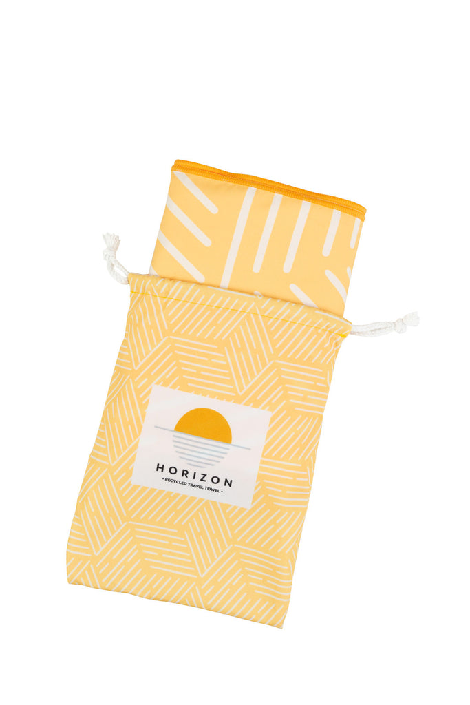 Yellow Bag with Light Weight and Compact Travel Towel inside Product-Towel-Horizon